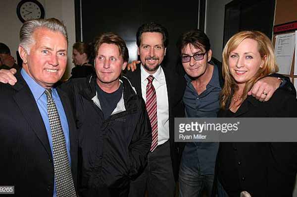 Martin Sheen taking a picture with his children.